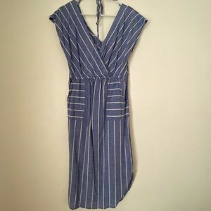 Long curve hugging dress with low back and pockets